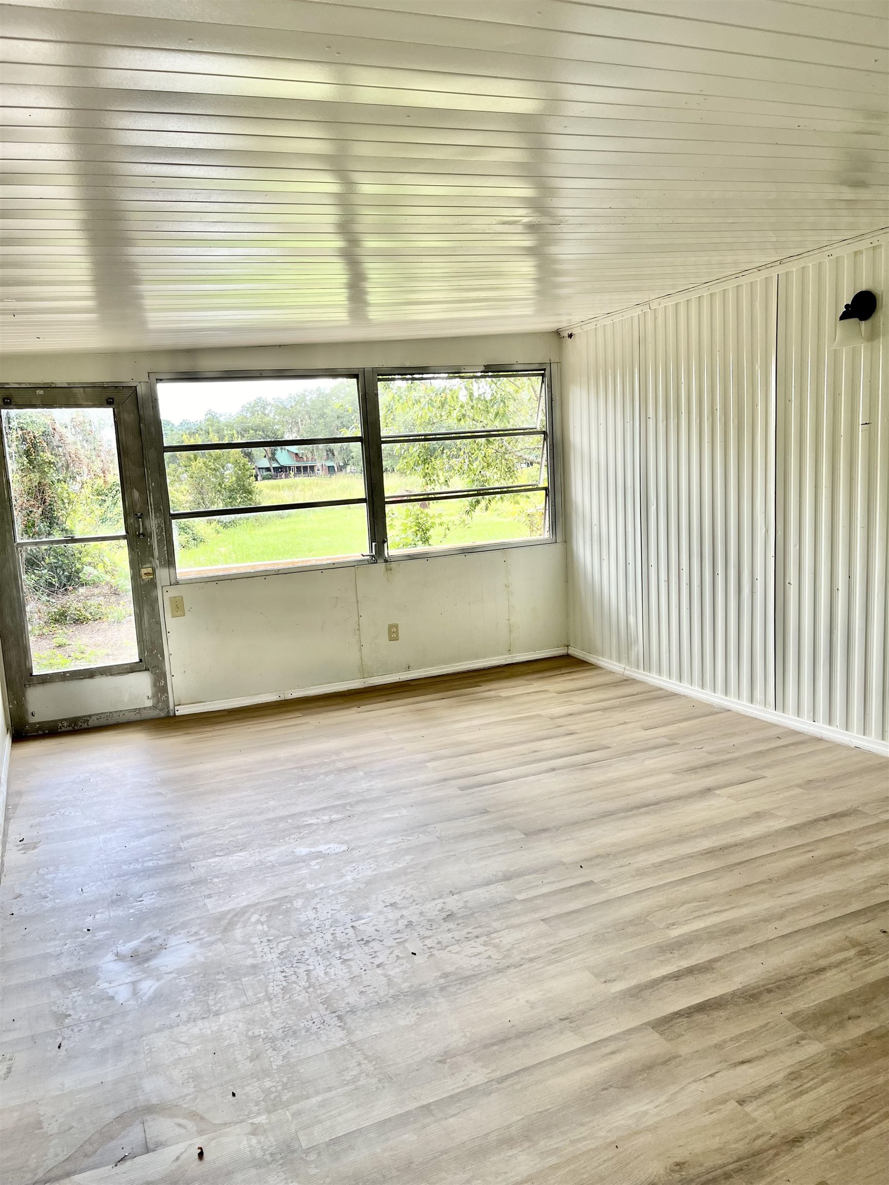 23670 Northeast 154th Place Road Salt Springs, FL 32134 - Photo 28 of 65 a view of an empty room with a window