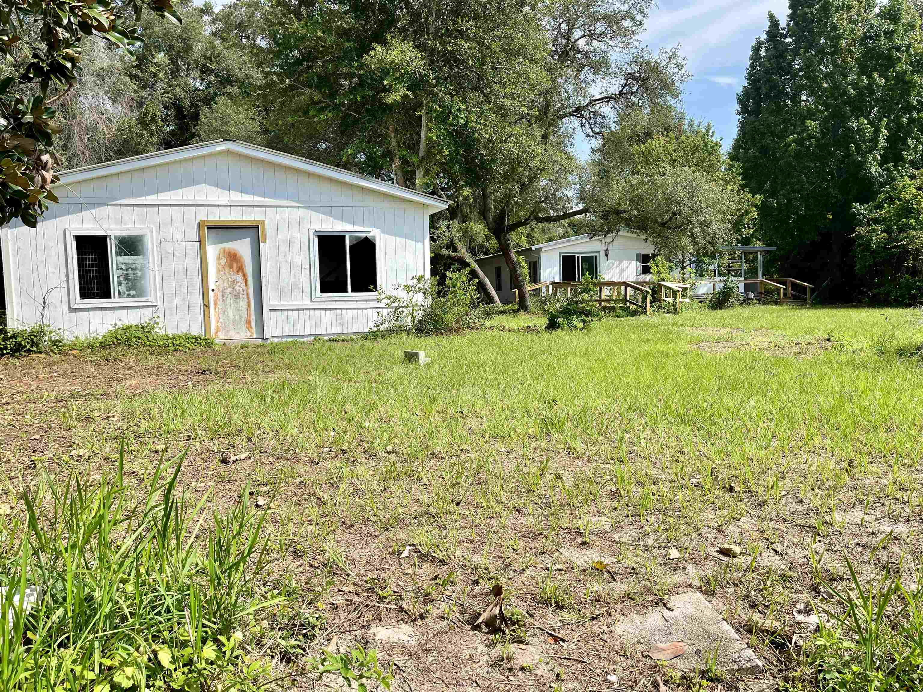 23670 Northeast 154th Place Road Salt Springs, FL 32134 - Photo 36 of 65 a front view of a house with a yard