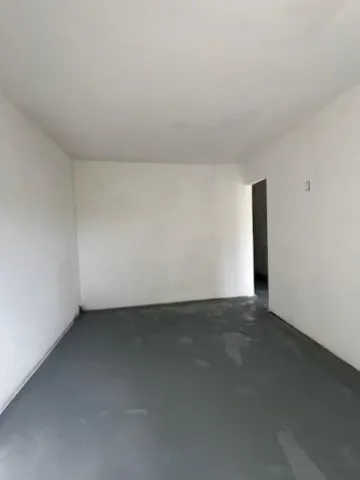 a view of a lake with a house in the background