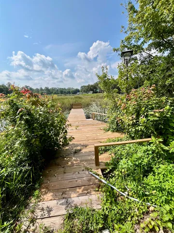 an aerial view of a house with yard swimming pool and outdoor seating