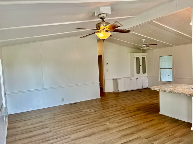 a view of a kitchen and a tub