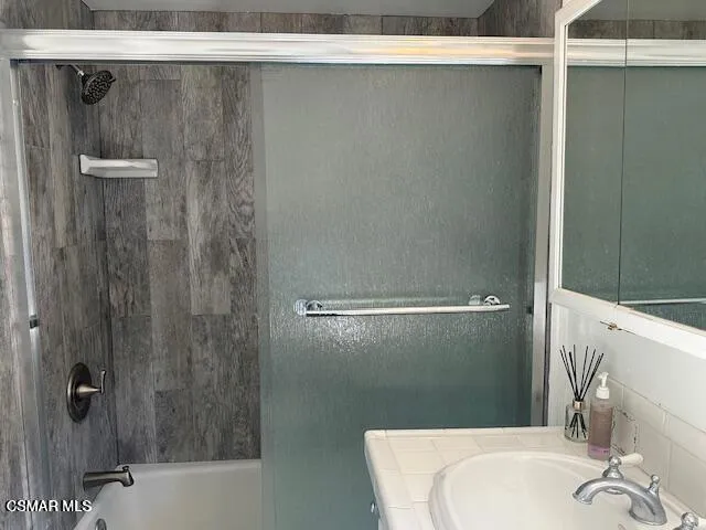 a bathroom with a sink and a tub