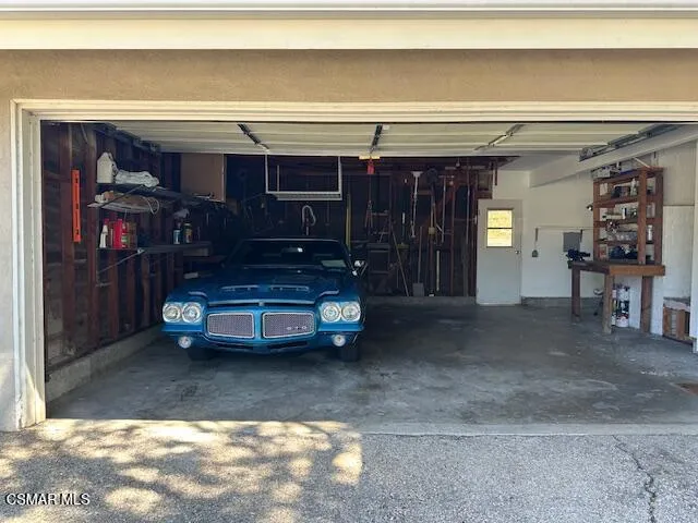 a view of an empty room with shelves