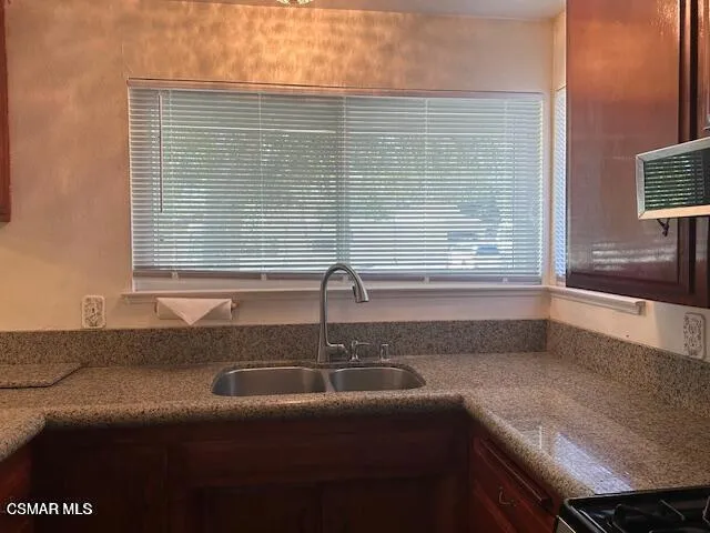 a view of a bathroom with a sink and a window