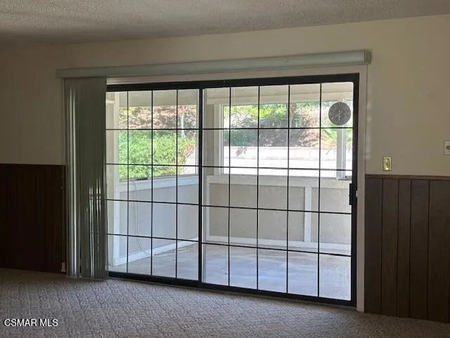 a view of a room that has a large window