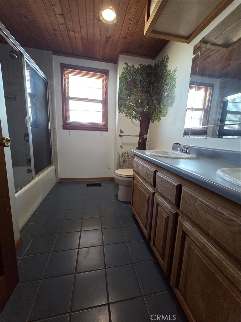 5480 Sunnyslope Road Phelan, CA 92371 - Photo 24 of 47 a kitchen with a sink a counter top space and appliances