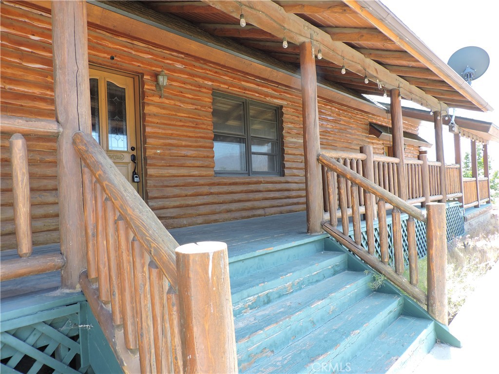 5480 Sunnyslope Road Phelan, CA 92371 - Photo 38 of 47 a view of staircase with wooden floor and fence