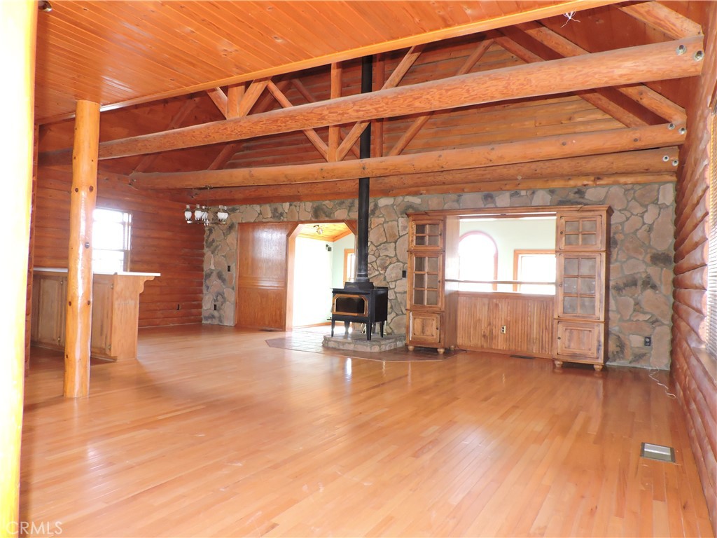 5480 Sunnyslope Road Phelan, CA 92371 - Photo 39 of 47 a view of a room with wooden floor and a window