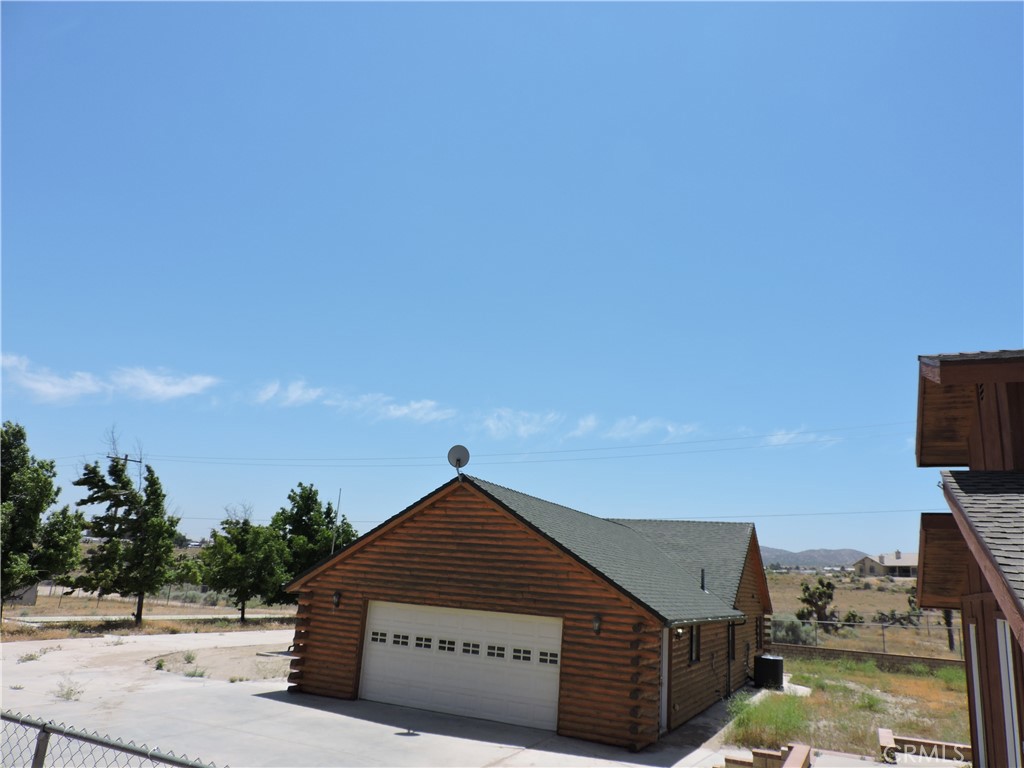 5480 Sunnyslope Road Phelan, CA 92371 - Photo 40 of 47 a front view of a house with a yard