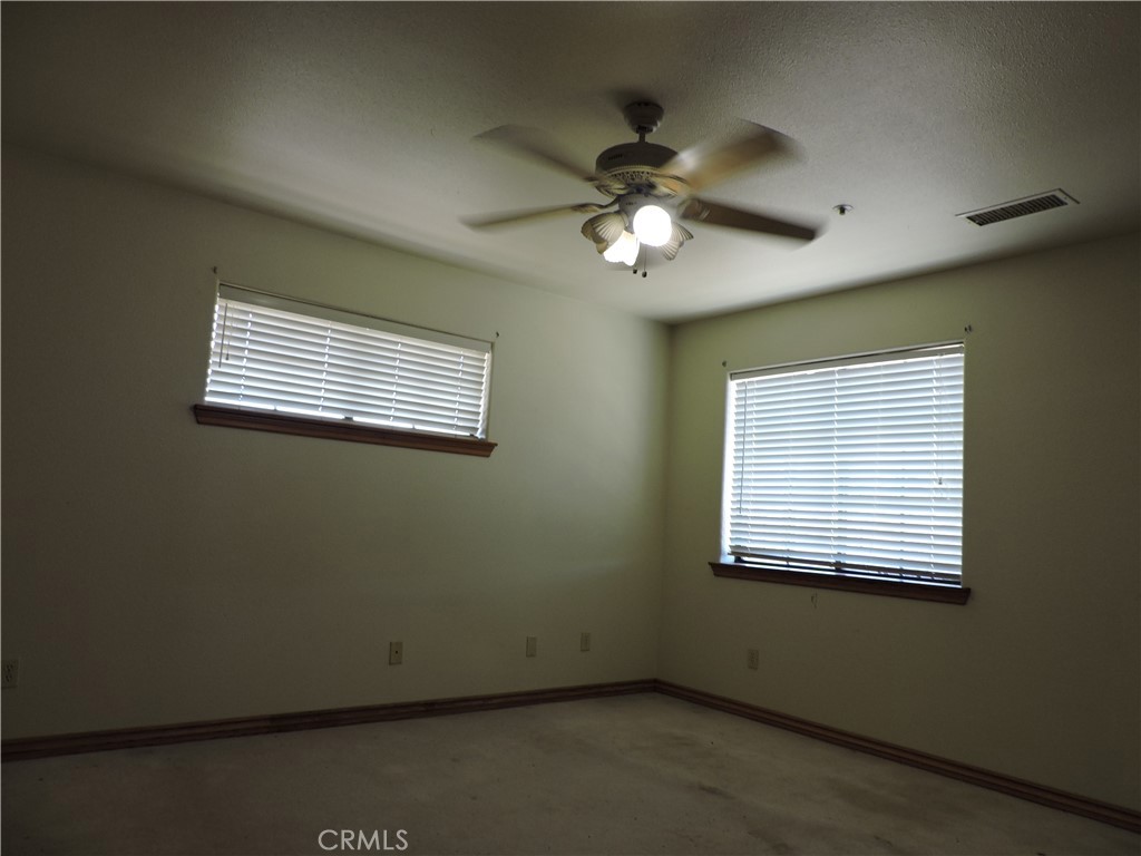 5480 Sunnyslope Road Phelan, CA 92371 - Photo 8 of 47 a view of a livingroom with a ceiling fan and a window