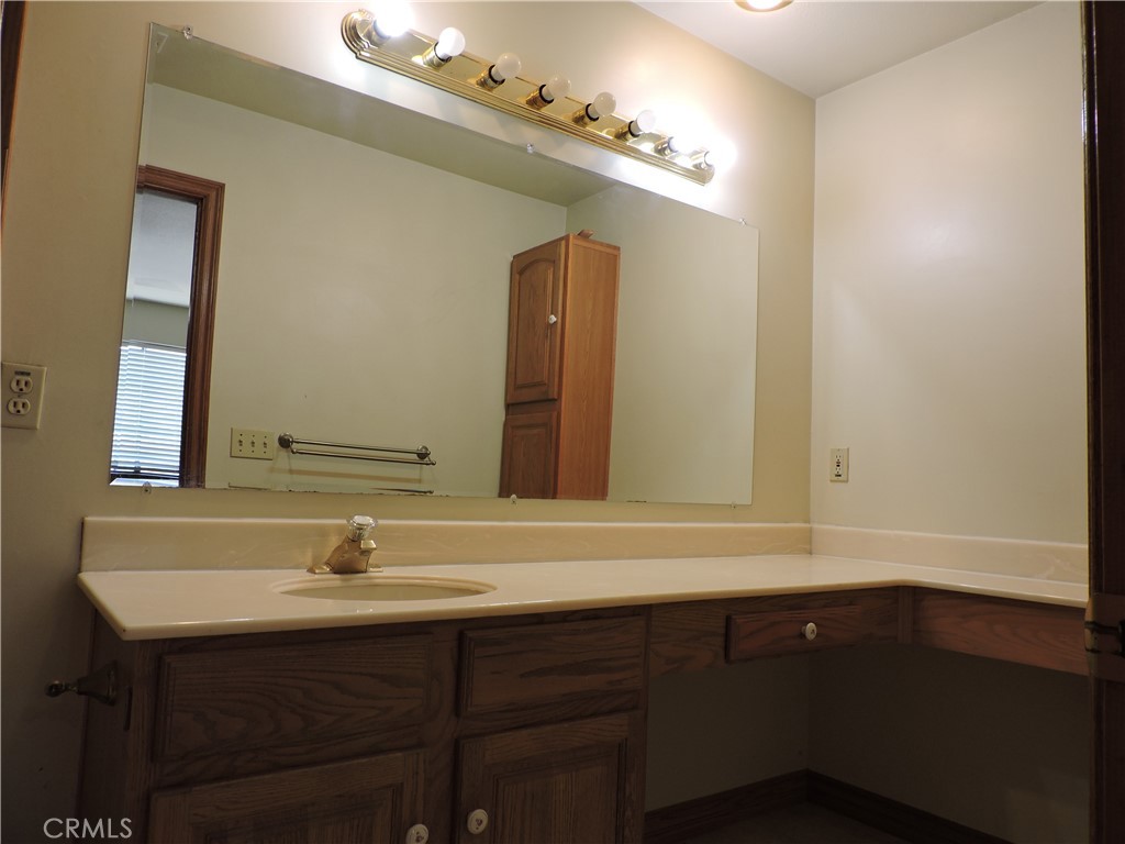 5480 Sunnyslope Road Phelan, CA 92371 - Photo 9 of 47 a bathroom with a sink double vanity and a mirror