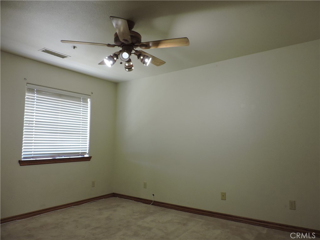5480 Sunnyslope Road Phelan, CA 92371 - Photo 10 of 47 an empty room with a window