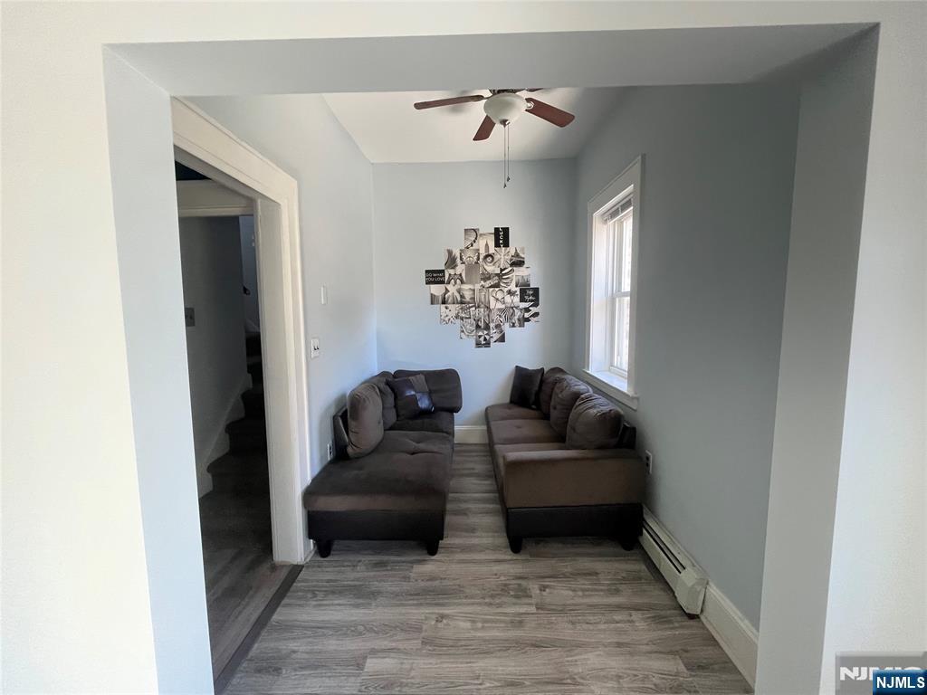 129 Orient Way, Unit 2 Lyndhurst, NJ 07071 - Photo 11 of 29 a living room with furniture and a fireplace