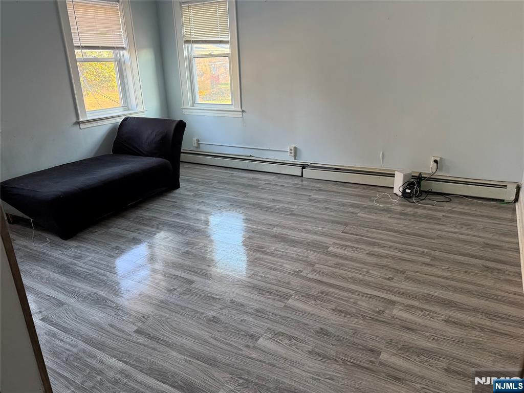 129 Orient Way, Unit 2 Lyndhurst, NJ 07071 - Photo 13 of 29 a living room with couch and a window