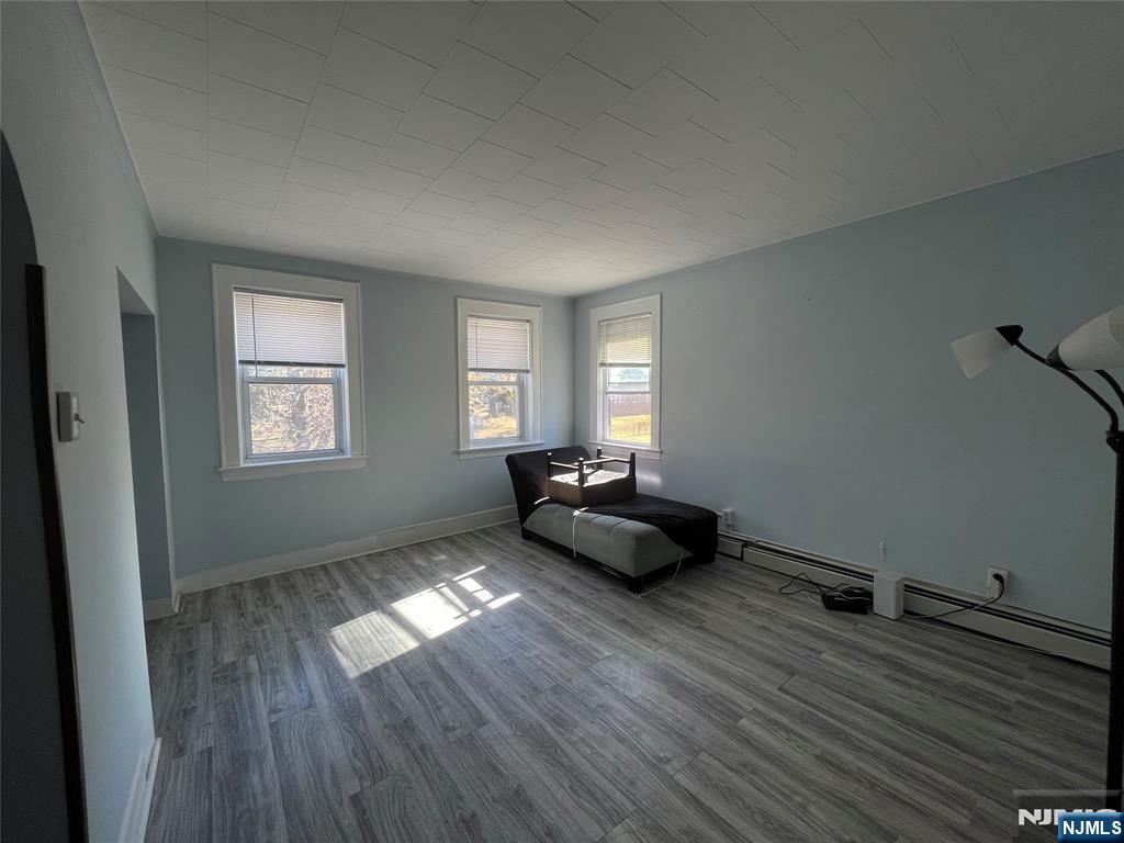 129 Orient Way, Unit 2 Lyndhurst, NJ 07071 - Photo 14 of 29 a living room with furniture and wooden floor