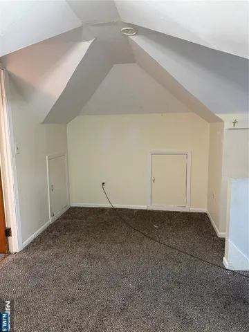 a view of livingroom with furniture and refrigerator