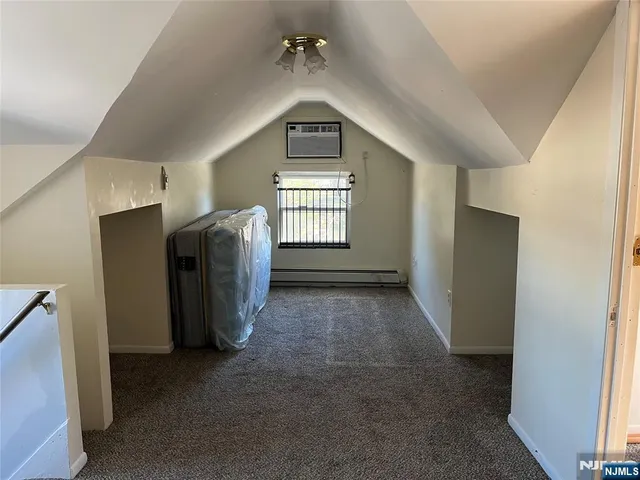 a view of a big room with closet and windows