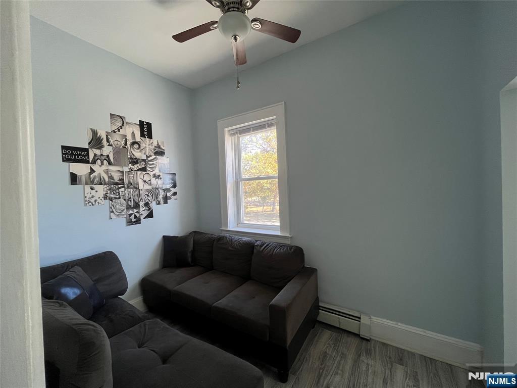 129 Orient Way, Unit 2 Lyndhurst, NJ 07071 - Photo 9 of 29 a living room with furniture and a window