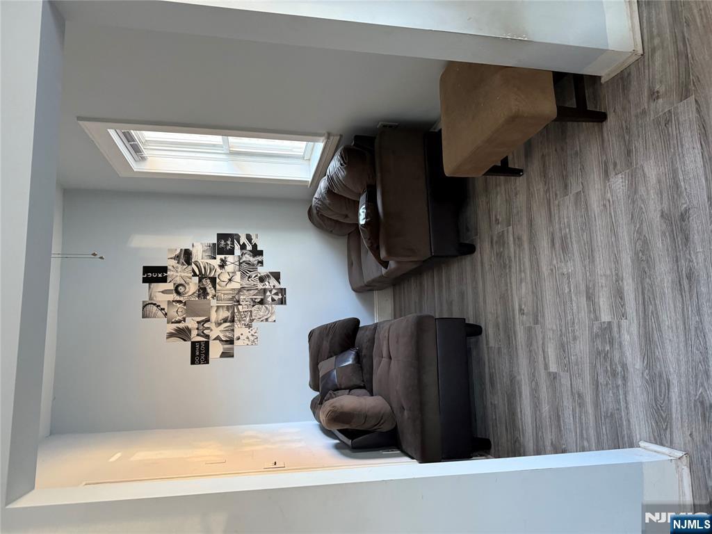 129 Orient Way, Unit 2 Lyndhurst, NJ 07071 - Photo 10 of 29 a living room with furniture and a window