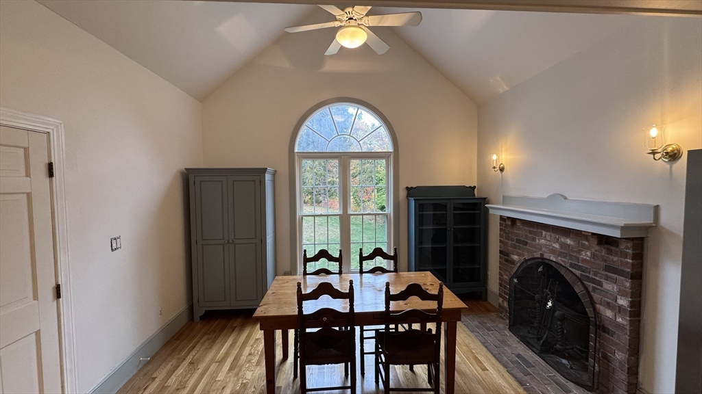 191 Chestnut Street, Unit 1 Duxbury, MA 02332 - Photo 4 of 20 a view of a livingroom with furniture window and a fireplace