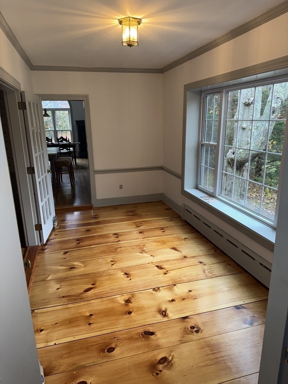 191 Chestnut Street, Unit 1 Duxbury, MA 02332 - Photo 7 of 20 a view of a room with wooden floor and staircase