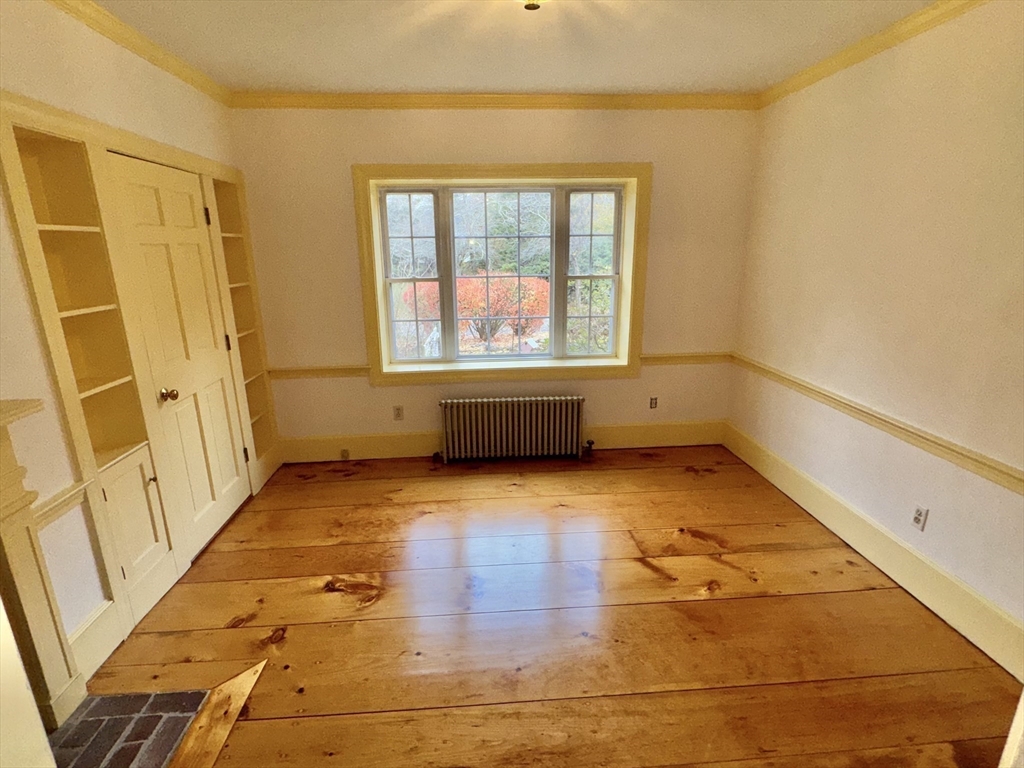 191 Chestnut Street, Unit 1 Duxbury, MA 02332 - Photo 10 of 20 a view of an empty room with a window