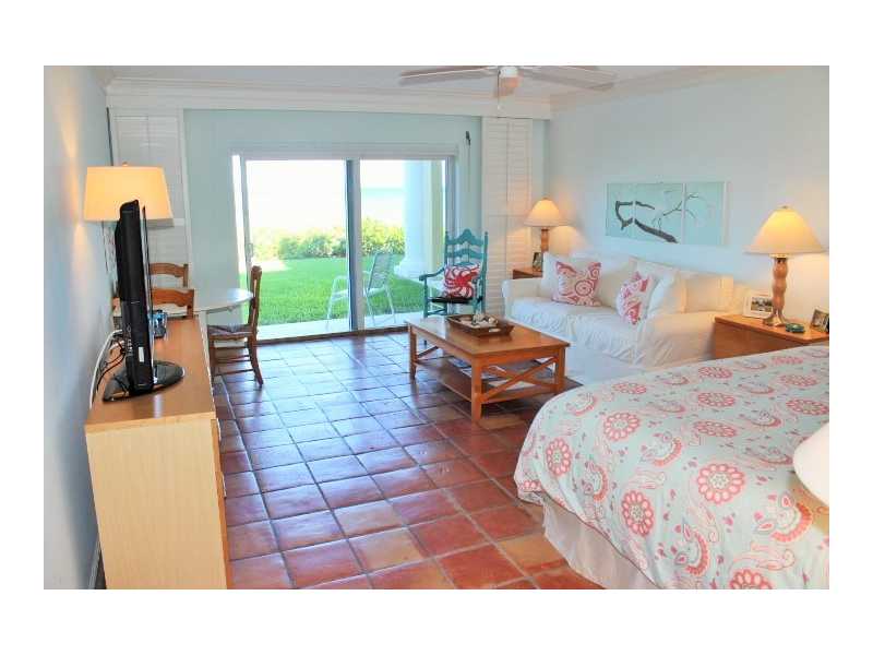400 Beach Road, Unit 141 Vero Beach, FL 32963 - Photo 3 of 11 a living room with furniture and a large window