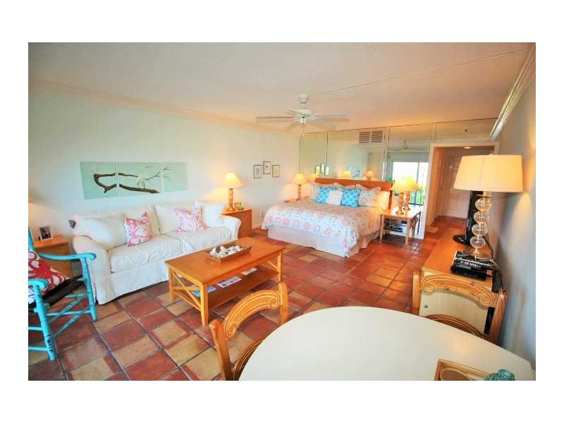 400 Beach Road, Unit 141 Vero Beach, FL 32963 - Photo 5 of 11 a living room with furniture and a flat screen tv