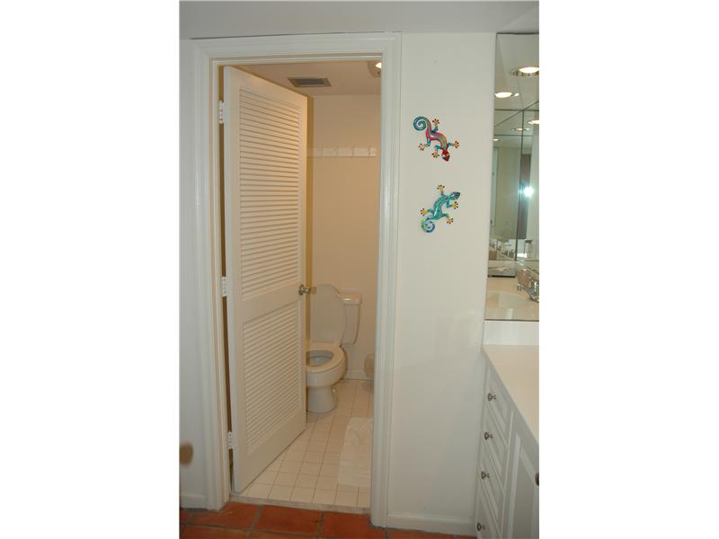 400 Beach Road, Unit 141 Vero Beach, FL 32963 - Photo 8 of 11 a bathroom with a shower and a sink