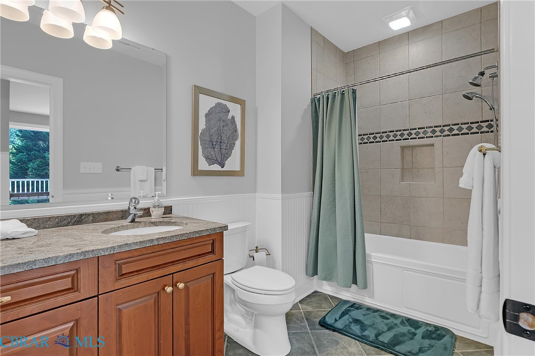 2106 Clarketown Road Heathsville, VA 22473 - Photo 38 of 56 a bathroom with a granite countertop sink toilet and shower