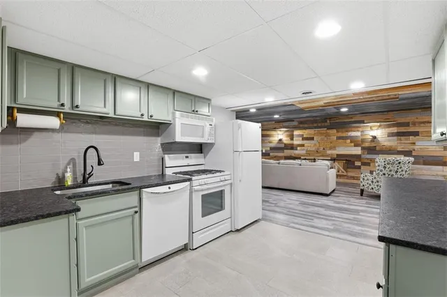 a kitchen with a sink and cabinets