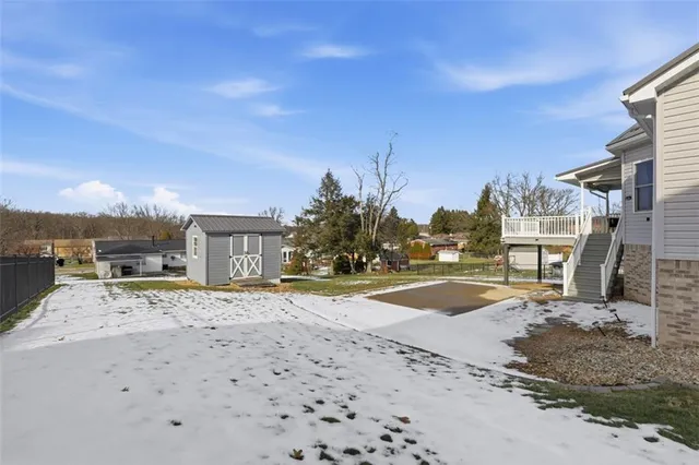 a living room with furniture a ceiling fan and a rug