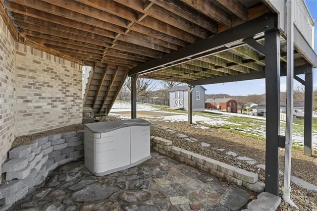 a view of a balcony with wooden floor and city view