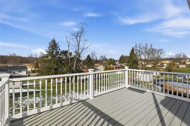 a backyard of a house with a yard and seating space