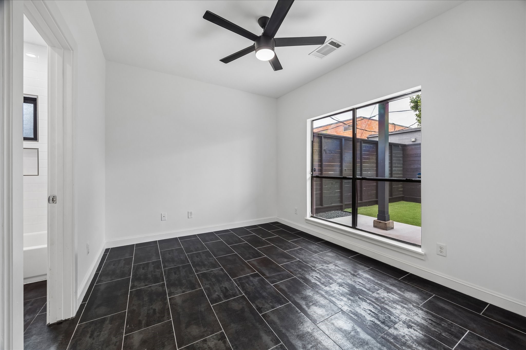 2510 Genesee Street Houston, TX 77006 - Photo 30 of 40 First Floor Bedroom With Views of Patio & Backyard