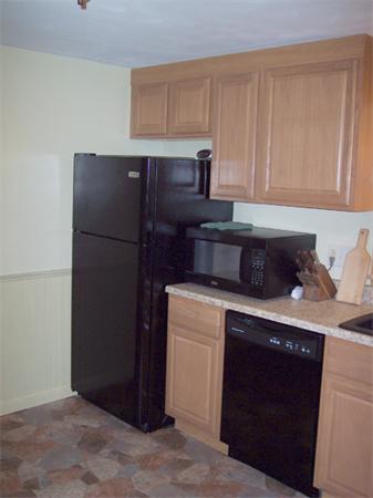 11 Ridgeview Road West Springfield, MA 01089 - Photo 9 of 9 a kitchen with a refrigerator stove and cabinets