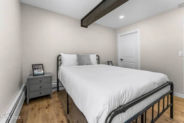 a living room with a flat screen tv and a fireplace