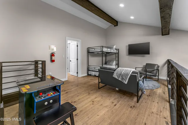 a bedroom with a bed and a couch