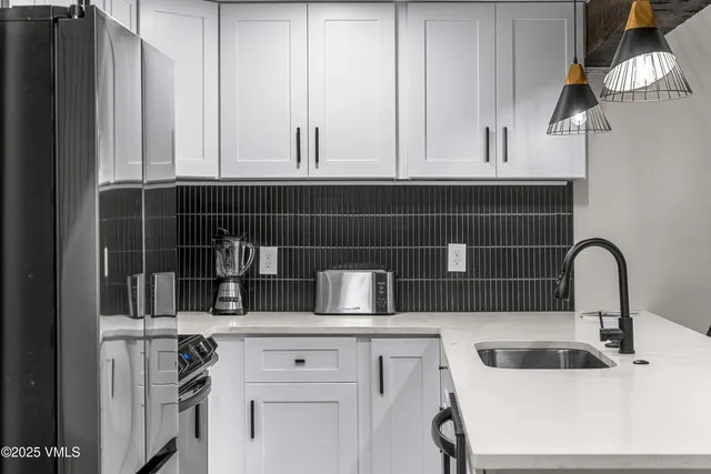 a living room with fireplace furniture and a flat screen tv