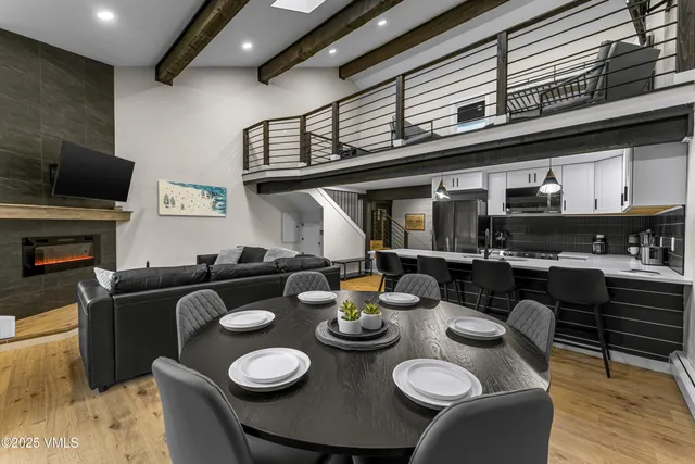 a view of a chairs and table on the roof