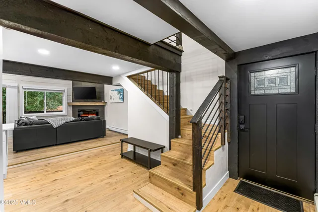 a bedroom with a bed and chair