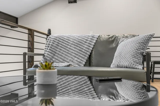 a view of balcony with wooden floor and fence
