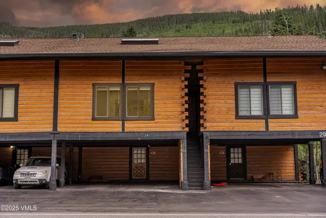 a kitchen with stainless steel appliances a refrigerator a stove a sink and a refrigerator