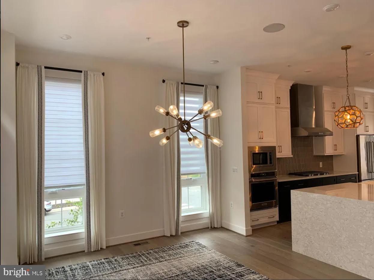 1870 Easterly Road Reston, VA 20190 - Photo 16 of 33 a view of a living room and a kitchen