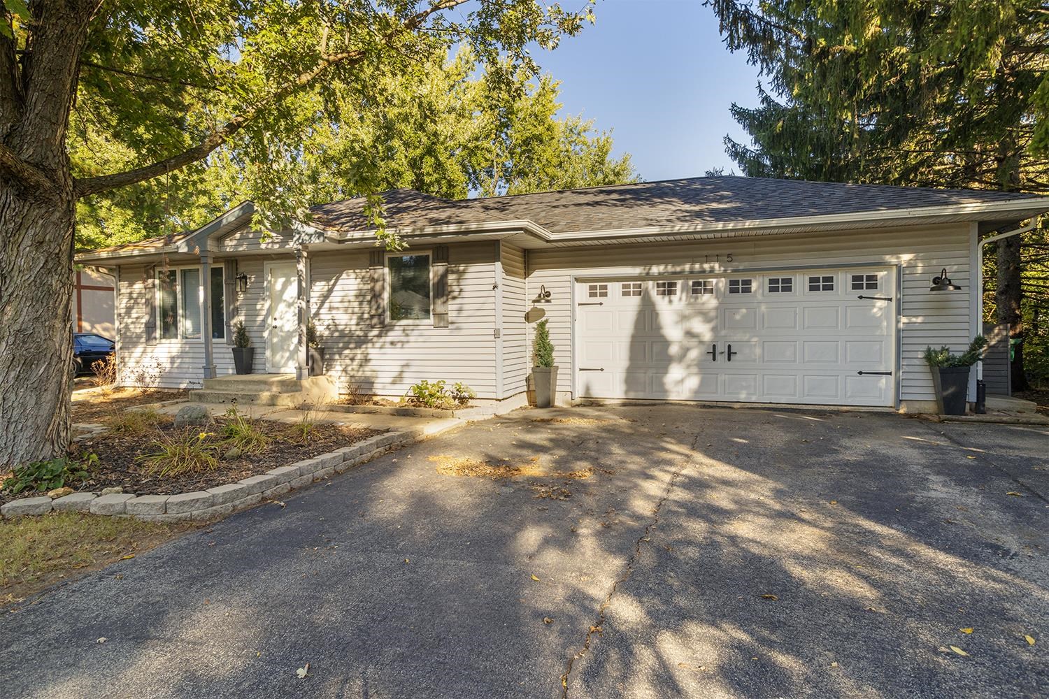 115 Lamplighter Loop Southeast Poplar Grove, IL 61065 - Photo 1 of 27 a view of a house with a yard