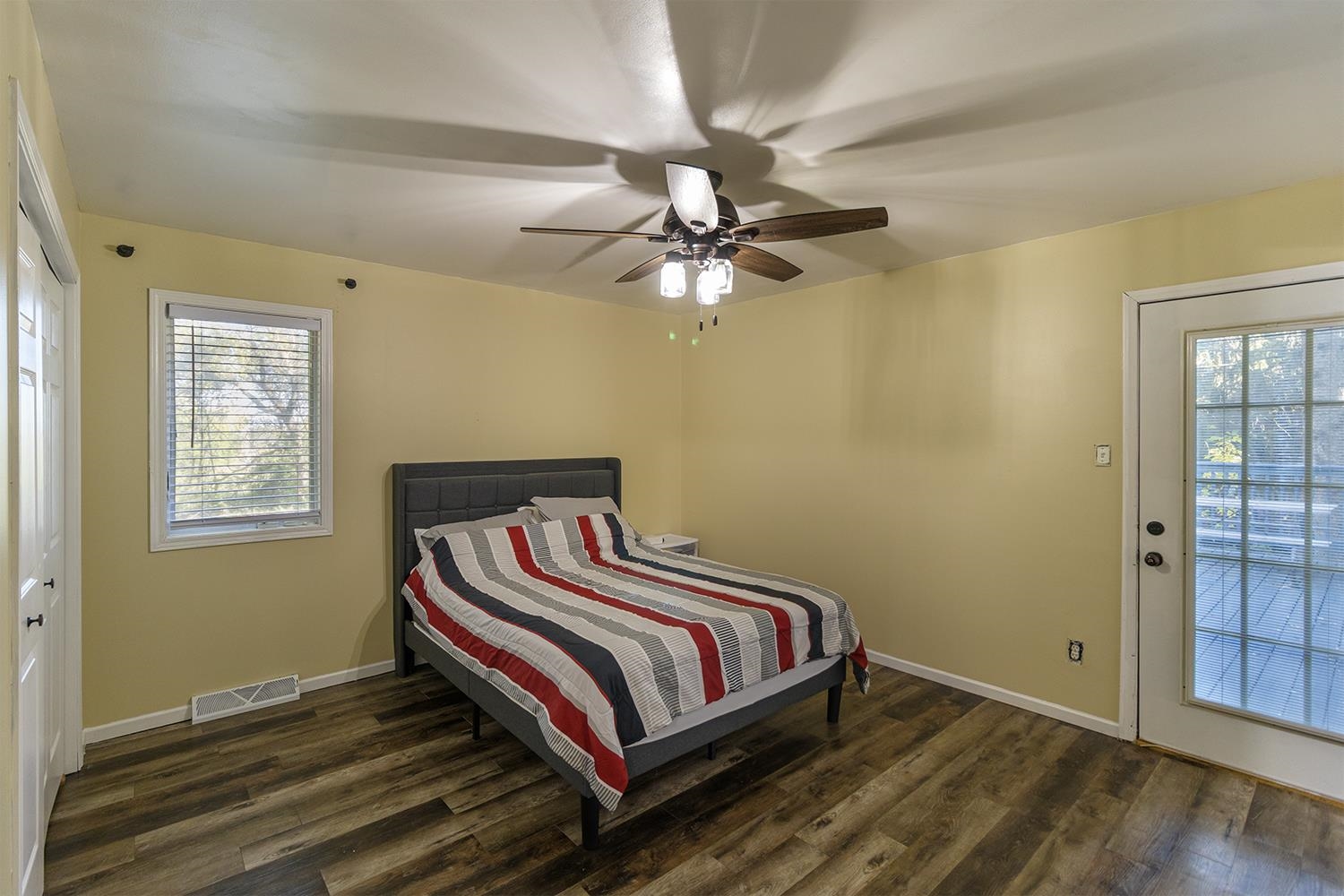 115 Lamplighter Loop Southeast Poplar Grove, IL 61065 - Photo 14 of 27 a bedroom with a bed and a chandelier