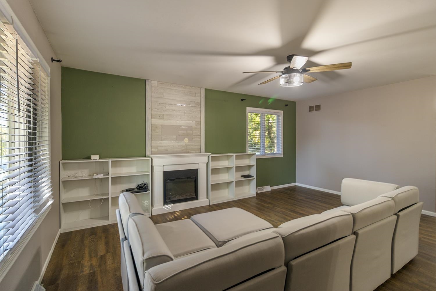 115 Lamplighter Loop Southeast Poplar Grove, IL 61065 - Photo 2 of 27 a living room with furniture and a fireplace