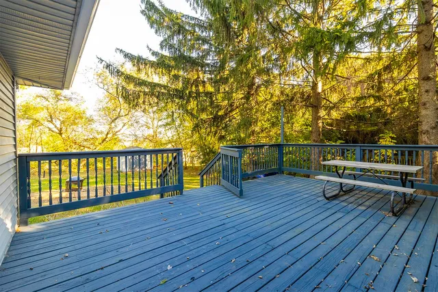 a view of outdoor space with wooden floor