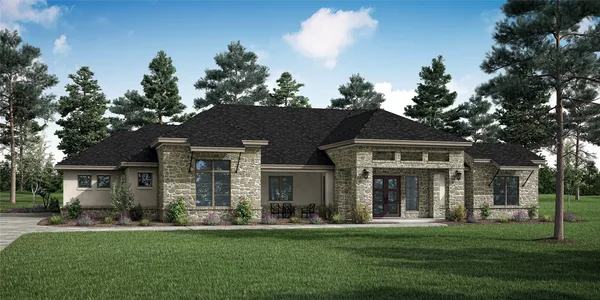 front view of a brick house with a yard