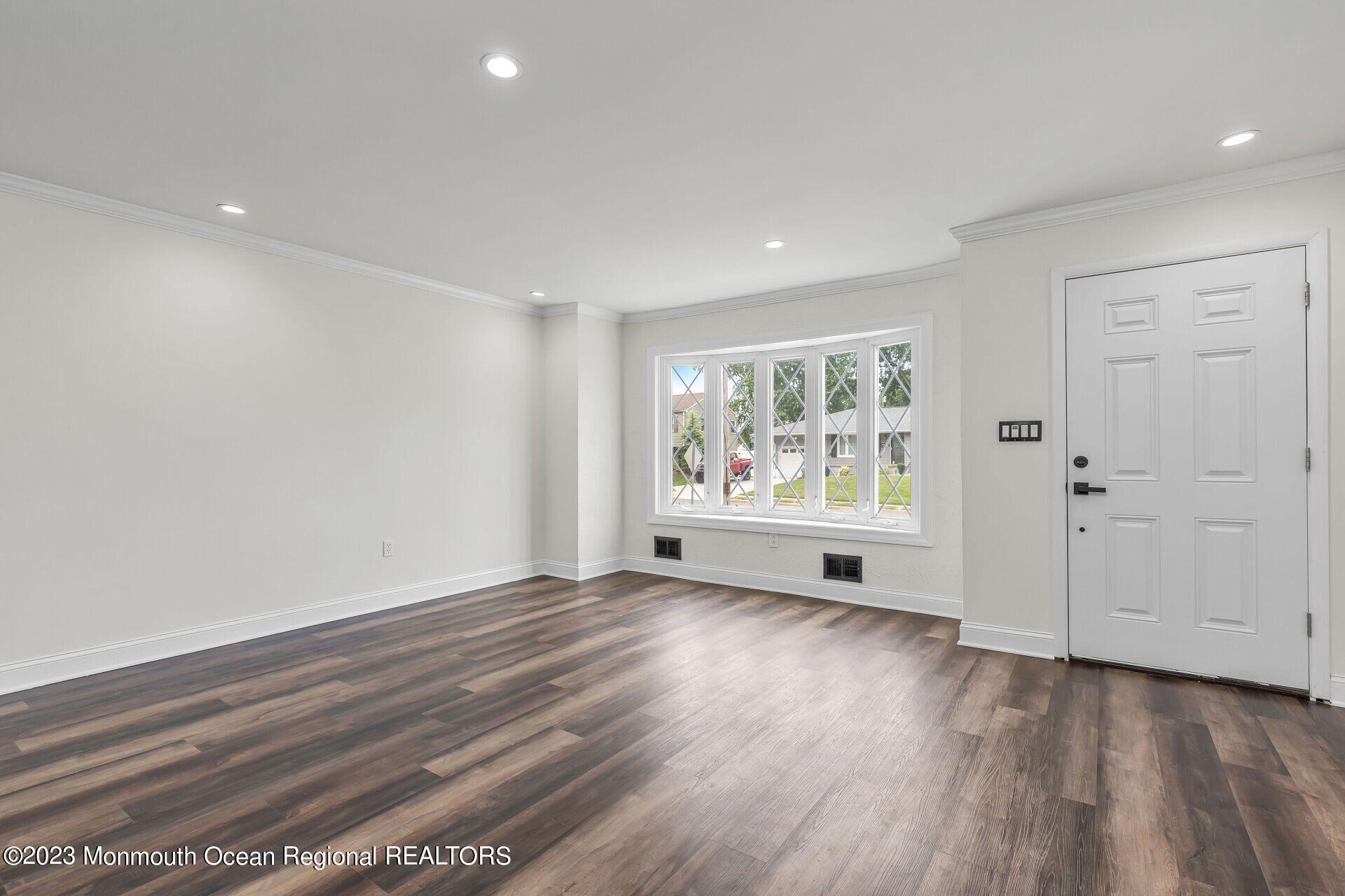 28 Copperfield Drive Hamilton, NJ 08610 - Photo 10 of 26 a view of an empty room with wooden floor and a window